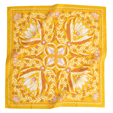 Yellow bandana with leaf pattern on a white background