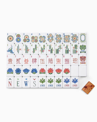 Set of Mahjong tiles with various symbols on a white background