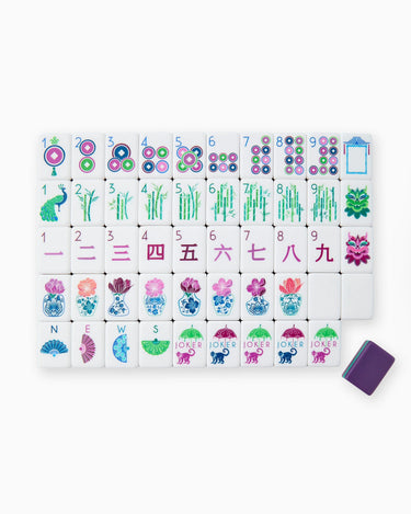 Set of colorful mahjong tiles with numbers and designs on a white background
