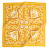 Yellow bandana with leaf pattern on a white background