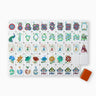 A set of Sierra Mahjong Tiles with a mix of geometric and natural patterns, held by a red dice/coin bag.